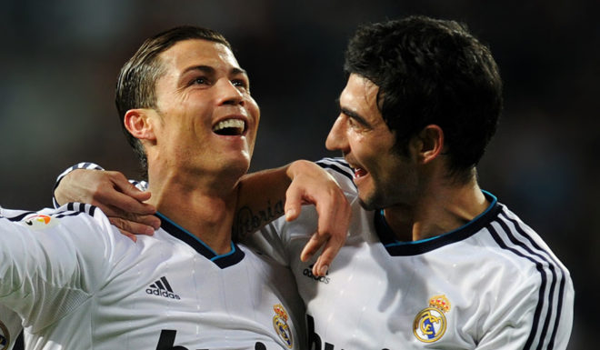 Real Madrid's Portuguese forward Cristiano Ronaldo (C) celbertaes after scoring with Real Madrid's Portuguese defender Fabio Coentrao (L) and Real Madrid's defender Raul Albiol during the Spanish league football match Real Madrid CF vs Sevilla FC at the Santiago Bernabeu stadium in Madrid on February 9, 2013. AFP PHOTO/ DOMINIQUE FAGET (Photo credit should read DOMINIQUE FAGET/AFP/Getty Images)