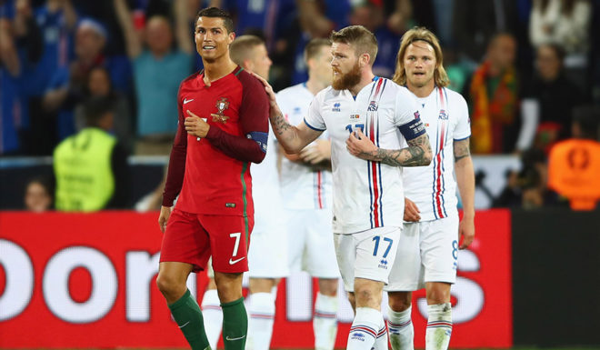 SAINT-ETIENNE, FRANCE - JUNE 14: Cristiano Ronaldo of Portugal and Aron Gunnarsson of Iceland in discussion after the UEFA EURO 2016 Group F match between Portugal and Iceland at Stade Geoffroy-Guichard on June 14, 2016 in Saint-Etienne, France. (Photo by Clive Brunskill/Getty Images)