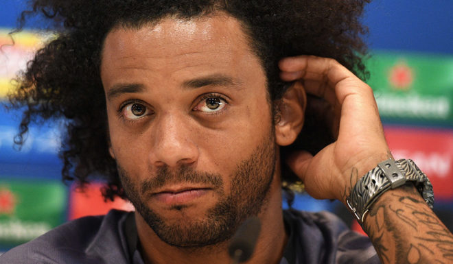 Real Madrid's Brazilian defender Marcelo gestures during a press conference at Valdebebas Sport City in Madrid on September 13, 2016 on the eve of the UEFA Champions League group stage football match Real Madrid CF vs Sporting Clube Portugal. / AFP / GERARD JULIEN (Photo credit should read GERARD JULIEN/AFP/Getty Images)