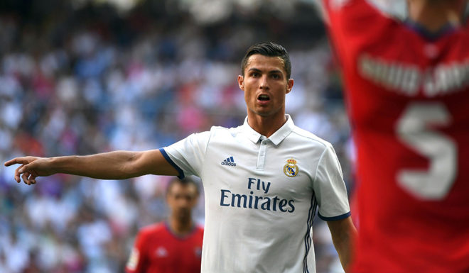 Real Madrid's Portuguese forward Cristiano Ronaldo gestures during the Spanish league football match Real Madrid CF vs CA Osasuna at the Santiago Bernabeu stadium in Madrid on September 10, 2016. / AFP / GERARD JULIEN (Photo credit should read GERARD JULIEN/AFP/Getty Images)