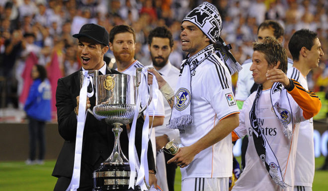 VALENCIA, SPAIN - APRIL 16: (From L-R) Cristiano Ronaldo, Pepe and Fabio Coentrao hold the Copa del Rey trophy after beating Barcelona 2-1 in the final at Estadio Mestalla on April 16, 2014 in Valencia, Spain. (Photo by Denis Doyle/Getty Images)