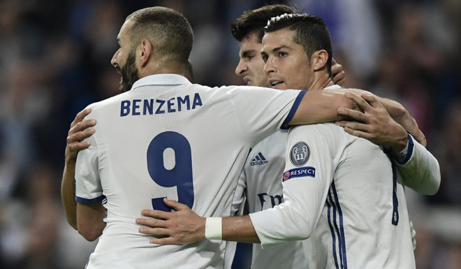 TOPSHOT - Real Madrid's forward Alvaro Morata (C), Real Madrid's Portuguese forward Cristiano Ronaldo (R) and Real Madrid's French forward Karim Benzema celebrate after scoring a goal during the UEFA Champions League football match Real Madrid CF vs Legia Legia Warszawa at the Santiago Bernabeu stadium in Madrid on October 18, 2016. / AFP / JAVIER SORIANO (Photo credit should read JAVIER SORIANO/AFP/Getty Images)