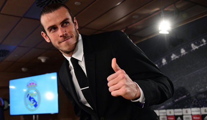 Real Madrid's Welsh forward Gareth Bale gestures before a press conference in the media room at the Santiago Bernabeu stadium in Madrid on October 31, 2016. Real Madrid and Gareth Bale have agreed an extension to the player's contract, keeping him at the club until the 30th of June 2022. / AFP / GERARD JULIEN (Photo credit should read GERARD JULIEN/AFP/Getty Images)