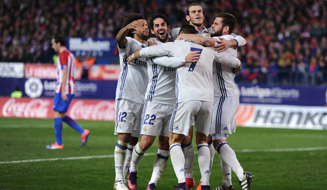 MADRID, SPAIN - NOVEMBER 19: Cristiano Ronaldo of Real Madrid celebrates with teammates after scoring Real's 3rd goal during the La Liga match between Club Atletico de Madrid and Real Madrid CF at Vicente Calderon Stadium on November 19, 2016 in Madrid, Spain. (Photo by Denis Doyle/Getty Images)