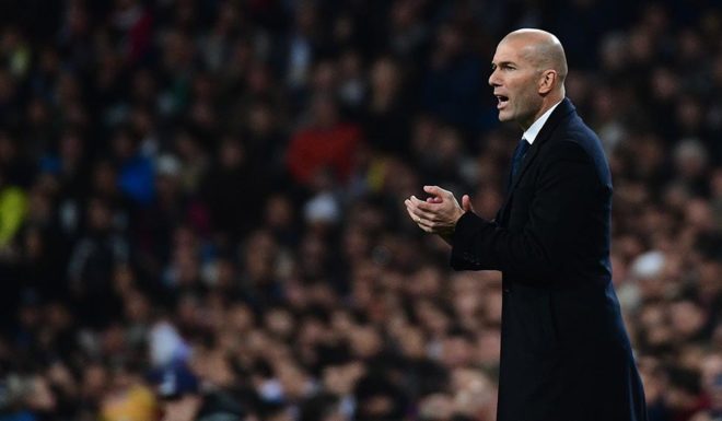 Real Madrid's French coach Zinedine Zidane aplaudds during the UEFA Champions League football match Real Madrid CF vs Borussia Dortmund at the Santiago Bernabeu stadium in Madrid on December 7, 2016. / AFP / PIERRE-PHILIPPE MARCOU (Photo credit should read PIERRE-PHILIPPE MARCOU/AFP/Getty Images)