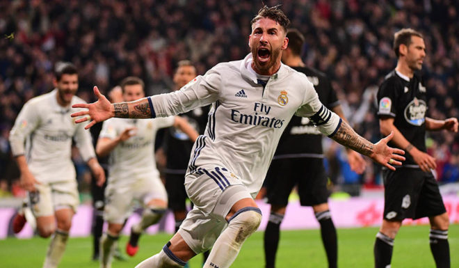 Real Madrid's defender Sergio Ramos celebrates after scoring during the Spanish league football match Real Madrid CF vs RC Deportivo at the Santiago Bernabeu stadium in Madrid on December 10, 2016. / AFP / PIERRE-PHILIPPE MARCOU (Photo credit should read PIERRE-PHILIPPE MARCOU/AFP/Getty Images)