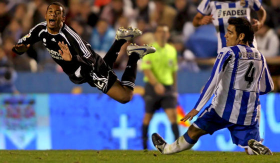 CORUNA, SPAIN: Real Madrid's new player Brazilian Marcelo Vieira (L) flies after been tackled by Deportivo Coruna's Argentinian Aldo Duscher (R) during their Spanish first League football match at the Riazor Stadium in Coruna, northwestern Spain, 07 January 2007. Deportivo won the match 2--0. AFP PHOTO/ Miguel RIOPA (Photo credit should read MIGUEL RIOPA/AFP/Getty Images)