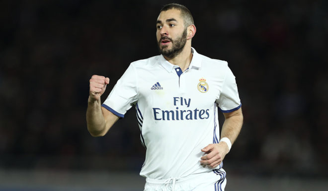 Real Madrid forward Karim Benzema celebrates scoring during the Club World Cup football final match between Kashima Antlers of Japan and Real Madrid of Spain at Yokohama International stadium in Yokohama on December 18, 2016. / AFP / Behrouz MEHRI (Photo credit should read BEHROUZ MEHRI/AFP/Getty Images)