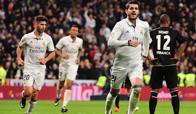 Real Madrid's forward Alvaro Morata celebrates after scoring during the Spanish league football match Real Madrid CF vs RC Deportivo at the Santiago Bernabeu stadium in Madrid on December 10, 2016. / AFP / PIERRE-PHILIPPE MARCOU (Photo credit should read PIERRE-PHILIPPE MARCOU/AFP/Getty Images)