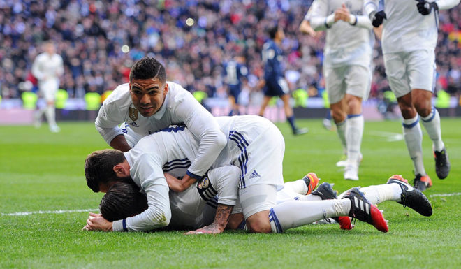 MADRID, SPAIN - JANUARY 21: Sergio Ramos of Real Madrid celebrates with Nacho and Henrique Casemiro after scoring his team's 1st goal during the La Liga match between Real Madrid CF and Malaga CF at the Bernabeu on January 21, 2017 in Madrid, Spain. (Photo by Denis Doyle/Getty Images)