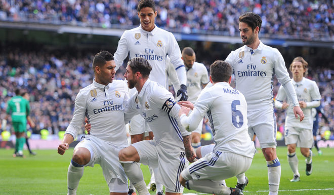 MADRID, SPAIN - JANUARY 21: Sergio Ramos of Real Madrid celebrates with Nacho and Henrique Casemiro after scoring his team's 1st goal during the La Liga match between Real Madrid CF and Malaga CF at the Bernabeu on January 21, 2017 in Madrid, Spain. (Photo by Denis Doyle/Getty Images)