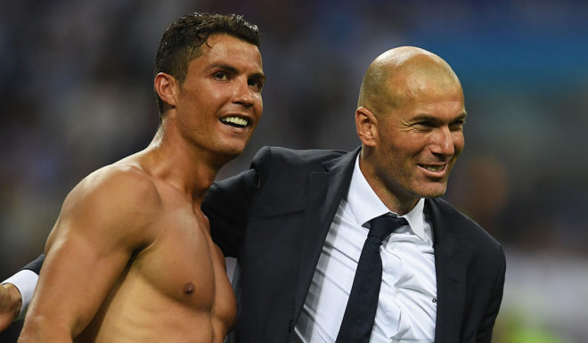 MILAN, ITALY - MAY 28: Real Madrid head coach Zinedine Zidane and Cristiano Ronaldo of Real Madrid celabrate after the UEFA Champions League Final match between Real Madrid and Club Atletico de Madrid at Stadio Giuseppe Meazza on May 28, 2016 in Milan, Italy. (Photo by Laurence Griffiths/Getty Images)