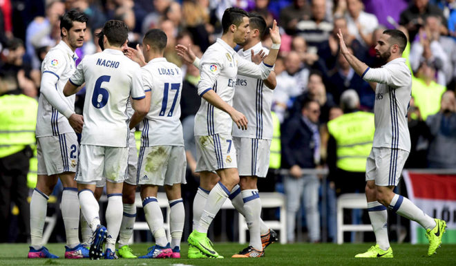 Real Madrid players celebrate a goal during the Spanish league football match Real Madrid CF vs RCD Espanyol at the Santiago Bernabeu stadium in Madrid on February 18, 2017. / AFP / JAVIER SORIANO (Photo credit should read JAVIER SORIANO/AFP/Getty Images)