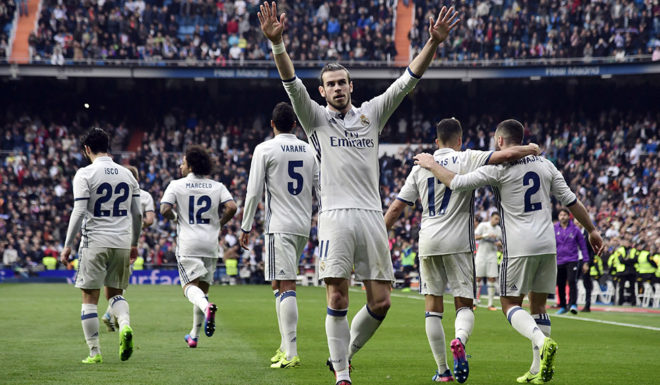 Real Madrid's Welsh forward Gareth Bale celebrates a goal during the Spanish league football match Real Madrid CF vs RCD Espanyol at the Santiago Bernabeu stadium in Madrid on February 18, 2017. / AFP / JAVIER SORIANO (Photo credit should read JAVIER SORIANO/AFP/Getty Images)