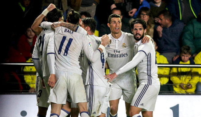 Real Madrid players celebrate their goal during the Spanish League football match Villarreal CF vs Real Madrid at El Madrigal stadium in Vila-real on February 26, 2017. / AFP / BIEL ALINO (Photo credit should read BIEL ALINO/AFP/Getty Images)