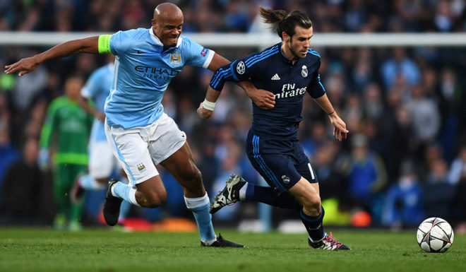 MANCHESTER, ENGLAND - APRIL 26: Gareth Bale of Real Madrid CF is challenged by Vincent Kompany of Manchester City during the UEFA Champions League Semi Final first leg match between Manchester City FC and Real Madrid at the Etihad Stadium on April 26, 2016 in Manchester, United Kingdom. (Photo by Shaun Botterill/Getty Images)