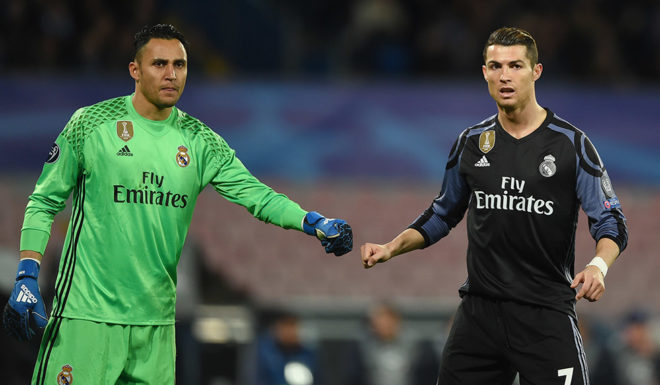 Real Madrid's Costa Rican goalkeeper Keylor Navas and Real Madrid's Portuguese forward Cristiano Ronaldo (R) during the UEFA Champions League football match SSC Napoli vs Real Madrid on March 7, 2017 at the San Paolo stadium in Naples. / AFP PHOTO / Filippo MONTEFORTE (Photo credit should read FILIPPO MONTEFORTE/AFP/Getty Images)