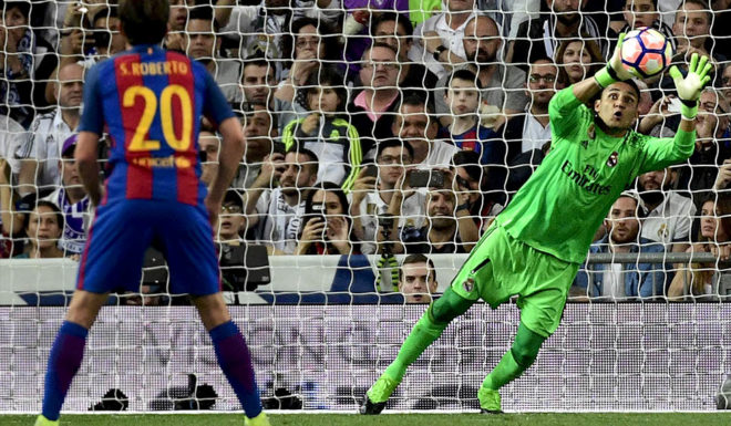 Real Madrid's Costa Rican goalkeeper Keylor Navas secures a ball during the Spanish league football match Real Madrid CF vs FC Barcelona at the Santiago Bernabeu stadium in Madrid on April 23, 2017. / AFP PHOTO / PIERRE-PHILIPPE MARCOU (Photo credit should read PIERRE-PHILIPPE MARCOU/AFP/Getty Images)
