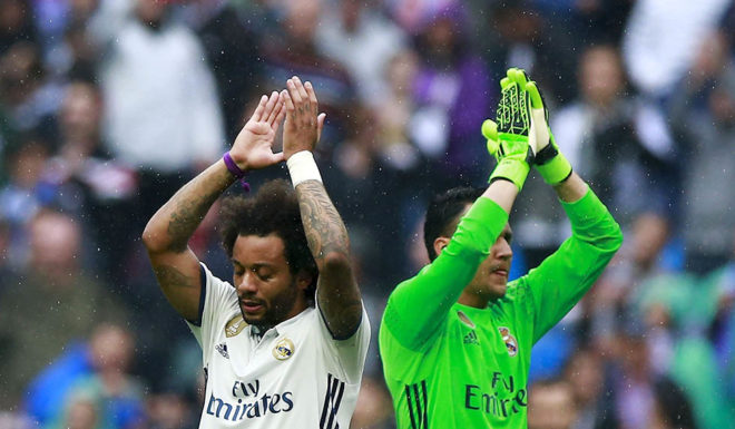 MADRID, SPAIN - APRIL 29: Marcelo (L) of Real Madrid CF celebrates with teammate goalkeeper Keylor Navas (R) after the La Liga match between Real Madrid CF and Valencia CF at Estadio Santiago Bernabeu on April 29, 2017 in Madrid, Spain. (Photo by Gonzalo Arroyo Moreno/Getty Images)