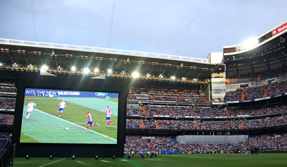 Real Madrid fans watch on a big screen at the Santiago Bernabeu stadium in Madrid on May 24, 2014 the UEFA Champions League football match final Atletico Madrid vs Real Madrid held held at the Luz stadium in Lisbon, Portugal. AFP PHOTO / CURTO DE LA TORRE (Photo credit should read CURTO DE LA TORRE/AFP/Getty Images)