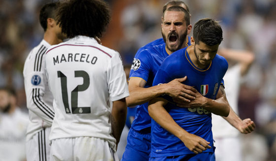 Real Madrid's Brazilian defender Marcelo (L) watches Juventus' Spanish forward Alvaro Morata (R) celebrate after scoring during the UEFA Champions League semifinal second leg football match Real Madrid FC vs Juventus at the Santiago Bernabeu stadium in Madrid on May 13, 2015. AFP PHOTO / DANI POZO (Photo credit should read DANI POZO/AFP/Getty Images)