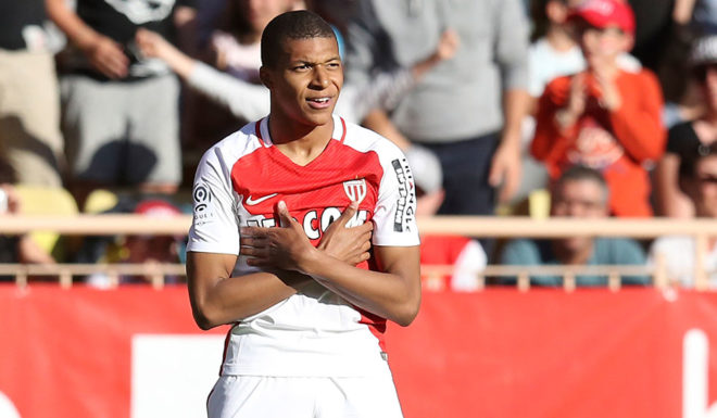 Monaco's French forward Kylian Mbappe Lottin celebrates after scoring a goal during the French L1 football match Monaco (ASM) vs Toulouse (TFC) on April 29, 2017 at the "Louis II Stadium" in Monaco. / AFP PHOTO / VALERY HACHE (Photo credit should read VALERY HACHE/AFP/Getty Images)