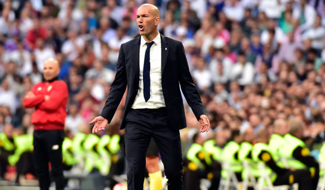 Real Madrid's French coach Zinedine Zidane gestures during the Spanish league football match Real Madrid CF vs Sevilla FC at the Santiago Bernabeu stadium in Madrid on May 14, 2017. / AFP PHOTO / GERARD JULIEN (Photo credit should read GERARD JULIEN/AFP/Getty Images)