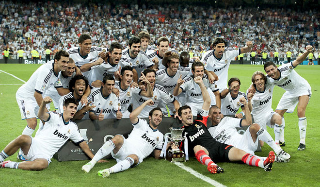 Real Madrid's players pose as they celebrate their victory 2-1 over Barcelona at the end of the second leg of the Spanish Supercup football match Real Madrid CF vs FC Barcelona on August 29, 2012 at the Santiago Bernabeu stadium in Madrid. AFP PHOTO/ DANI POZO (Photo credit should read DANI POZO/AFP/GettyImages)