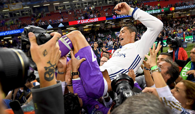 CARDIFF, WALES - JUNE 03: Cristiano Ronaldo of Real Madrid is thrown into the air by his Real Madrid team mates after the UEFA Champions League Final between Juventus and Real Madrid at National Stadium of Wales on June 3, 2017 in Cardiff, Wales. (Photo by David Ramos/Getty Images)