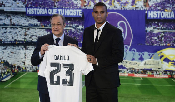 Brazilian Danilo (R) poses with Real Madrid's President Florentino Perez as they hold Danilo's jersey during his presentation as new player of Real Madrid Football Club at Santiago Bernabeu stadium in Madrid on July 9, 2015. AFP PHOTO/ PIERRE-PHILIPPE MARCOU (Photo credit should read PIERRE-PHILIPPE MARCOU/AFP/Getty Images)