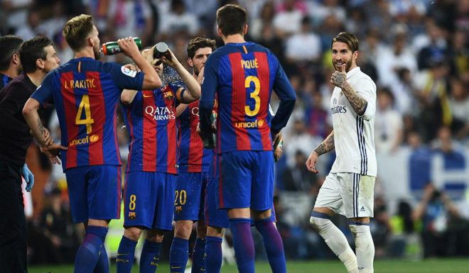 MADRID, SPAIN - APRIL 23: Sergio Ramos of Real Madrid (R) reacts towards Barcelona players as he is sent off during the La Liga match between Real Madrid CF and FC Barcelona at Estadio Bernabeu on April 23, 2017 in Madrid, Spain. (Photo by David Ramos/Getty Images)