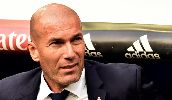 Real Madrid's French coach Zinedine Zidane looks on before the Spanish league football match Real Madrid CF vs Sevilla FC at the Santiago Bernabeu stadium in Madrid on May 14, 2017. / AFP PHOTO / GERARD JULIEN (Photo credit should read GERARD JULIEN/AFP/Getty Images)