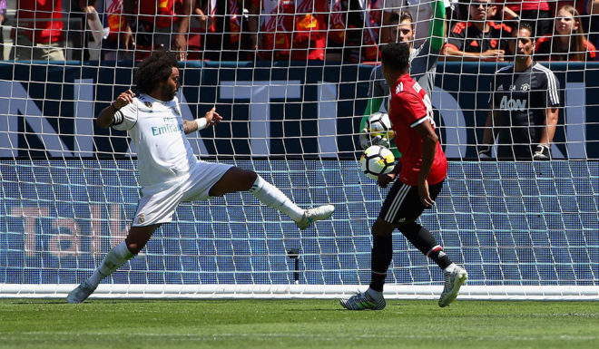 SANTA CLARA, CA - JULY 23: Jesse Lingard #14 of Manchester United scores a goal past Marcelo Da Silva Junior #12 of Real Madrid during the International Champions Cup match at Levi's Stadium on July 23, 2017 in Santa Clara, California. (Photo by Ezra Shaw/Getty Images)