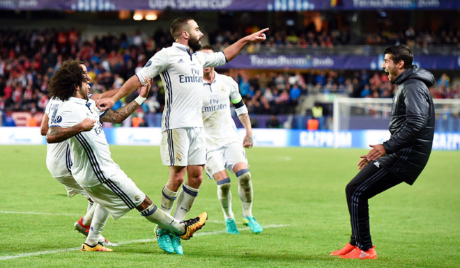 Real Madrid's Spanish defender Dani Carvajal (C) celebrates with his teammates after scoring the 3-2 goal at overtime during the UEFA Super Cup final football match between Real Madrid CF and Sevilla FC on August 9, 2016 at the Lerkendal Stadion in Trondheim. Real Madrid won 3-2. / AFP / JONATHAN NACKSTRAND (Photo credit should read JONATHAN NACKSTRAND/AFP/Getty Images)