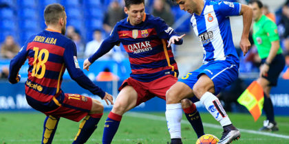 RCD Espanyol's Spanish midfielder Marco Asensio (R) vies with Barcelona's Argentinian forward Lionel Messi (C) during the Spanish league football match RCD Espanyol vs FC Barcelona at the Power8 stadium in Cornella de Llobregat on January 2, 2016. AFP PHOTO/ PAU BARRENA / AFP / PAU BARRENA (Photo credit should read PAU BARRENA/AFP/Getty Images)