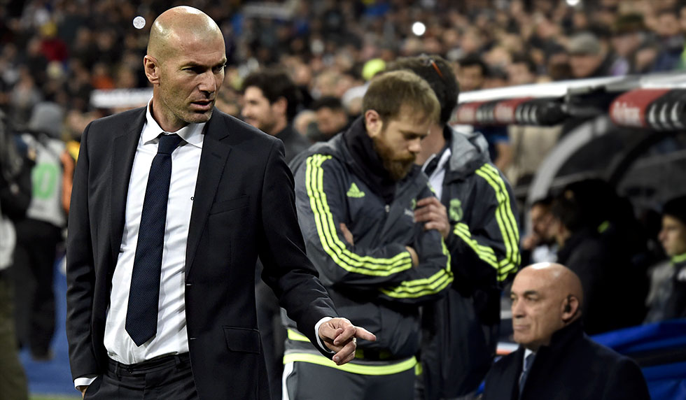 Real Madrid's new French coach Zinedine Zidane gestures before the Spanish league football match Real Madrid CF vs RC Deportivo La Coruna at the Santiago Bernabeu stadium in Madrid on January 9, 2016. AFP PHOTO / GERARD JULIEN / AFP / GERARD JULIEN (Photo credit should read GERARD JULIEN/AFP/Getty Images)