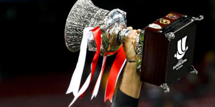 Athletic Bilbao's coach Ernesto Valverde raises the Supercup trophy after the Spanish Supercup second-leg football match FC Barcelona vs Athletic Club Bilbao at the Camp Nou stadium in Barcelona on August 17, 2015. AFP PHOTO / QUIQUE GARCIA (Photo credit should read QUIQUE GARCIA/AFP/Getty Images)