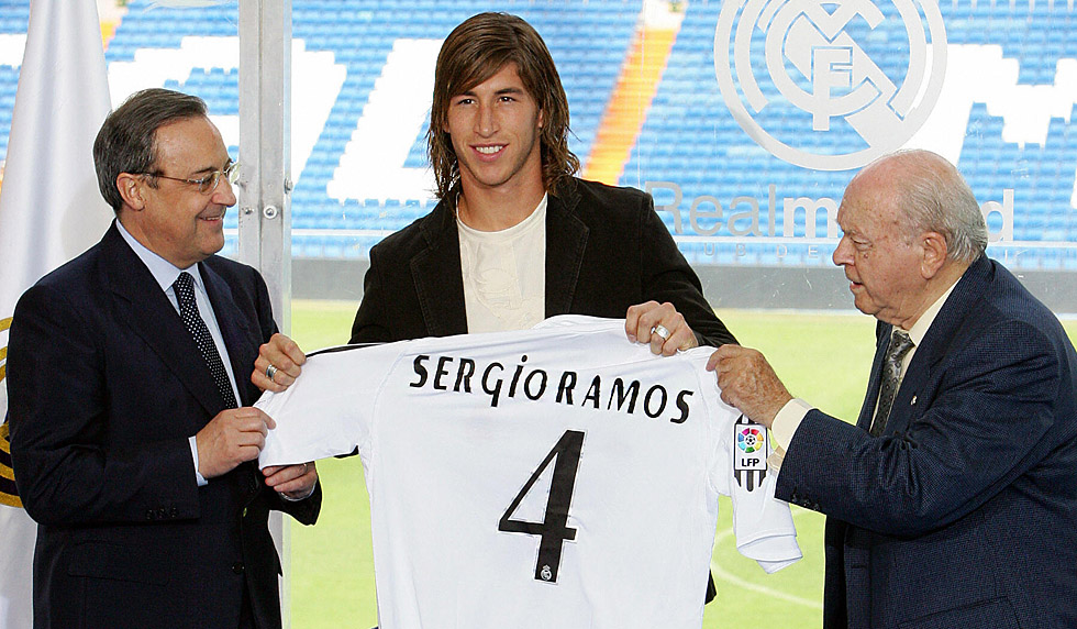 MADRID, Spain: Real Madrid's president Florentino Perez (L) stands with new Spanish signing Sergio Ramos (C) and former Real Madrid player Alberto di Stefano as he is presented to the press at the Santiago Bernabeu stadium in Madrid, 08 September 2005. Ramos, formerly of Spanish club Seville was bought out of his contract for 27 million euros. The Ramos deal brings Real's summer spending on new players to 90 million euros. AFP PHOTO/PHILIPPE DESMAZES (Photo credit should read PHILIPPE DESMAZES/AFP/Getty Images)