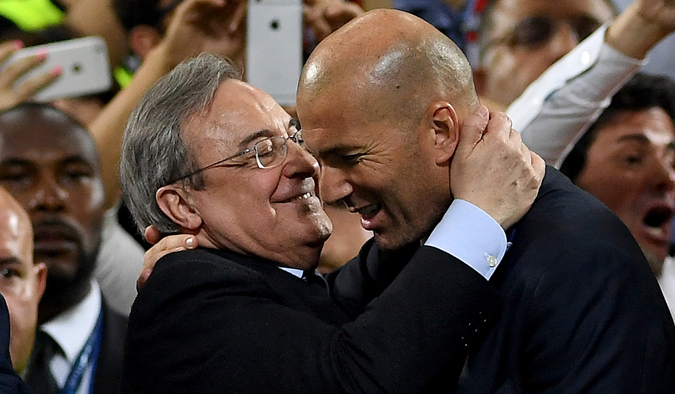 MILAN, ITALY - MAY 28: King Felipe VI of Spain looks on as Head coach Zinedine Zidane of Real Madrid is congratulated on winning the Champions League by Real Madrid President Florentino Perez afterthe UEFA Champions League Final match between Real Madrid and Club Atletico de Madrid at Stadio Giuseppe Meazza on May 28, 2016 in Milan, Italy. (Photo by Laurence Griffiths/Getty Images)