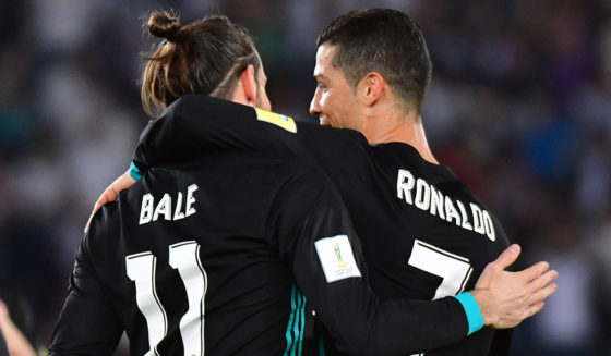 Real Madrid's Welsh forward Gareth Bale (L) is congratulated after scoring by teammate Portuguese forward Cristiano Ronaldo (R) during the FIFA Club World Cup semi-final match in the Emirati capital Abu Dhabi on December 13, 2017. / AFP PHOTO / GIUSEPPE CACACE (Photo credit should read GIUSEPPE CACACE/AFP/Getty Images)
