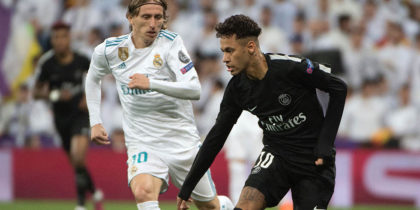 Real Madrid's Croatian midfielder Luka Modric (L) vies with Paris Saint-Germain's Brazilian forward Neymar (R) during the UEFA Champions League round of sixteen first leg football match Real Madrid CF against Paris Saint-Germain (PSG) at the Santiago Bernabeu stadium in Madrid on February 14, 2018. / AFP PHOTO / CURTO DE LA TORRE (Photo credit should read CURTO DE LA TORRE/AFP/Getty Images)