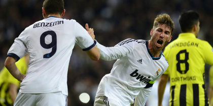 Real Madrid's defender Sergio Ramos (R) celebrates with Real Madrid's French forward Karim Benzema after scoring during the UEFA Champions League semi-final second leg football match Real Madrid CF vs Borussia Dortmund at the Santiago Bernabeu stadium in Madrid on April 30, 2013. AFP PHOTO / JAVIER SORIANO (Photo credit should read JAVIER SORIANO/AFP/Getty Images)