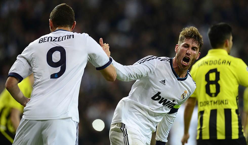 Real Madrid's defender Sergio Ramos (R) celebrates with Real Madrid's French forward Karim Benzema after scoring during the UEFA Champions League semi-final second leg football match Real Madrid CF vs Borussia Dortmund at the Santiago Bernabeu stadium in Madrid on April 30, 2013. AFP PHOTO / JAVIER SORIANO (Photo credit should read JAVIER SORIANO/AFP/Getty Images)