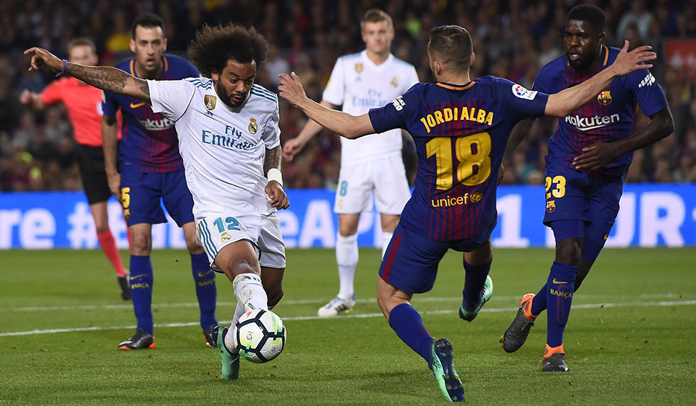 Barcelona's Spanish defender Jordi Alba (R) vies with Real Madrid's Brazilian defender Marcelo during the Spanish league football match between FC Barcelona and Real Madrid CF at the Camp Nou stadium in Barcelona on May 6, 2018. (Photo by Josep LAGO / AFP) (Photo credit should read JOSEP LAGO/AFP/Getty Images)