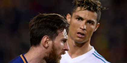 TOPSHOT - Real Madrid's Portuguese forward Cristiano Ronaldo (R) looks at Barcelona's Argentinian forward Lionel Messi during the Spanish league football match between FC Barcelona and Real Madrid CF at the Camp Nou stadium in Barcelona on May 6, 2018. (Photo by Josep LAGO / AFP) (Photo credit should read JOSEP LAGO/AFP/Getty Images)
