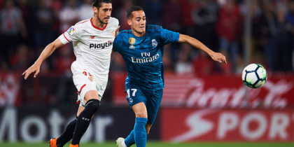 SEVILLE, SPAIN - MAY 09: Lucas Vazquez of Real Madrid CF (R) competes for the ball with Sergio Escudero of Sevilla FC (L) during the La Liga match between Sevilla FC and Real Madrid at Ramon Sanchez Pizjuan stadium on May 9, 2018 in Seville, Spain. (Photo by Aitor Alcalde/Getty Images)
