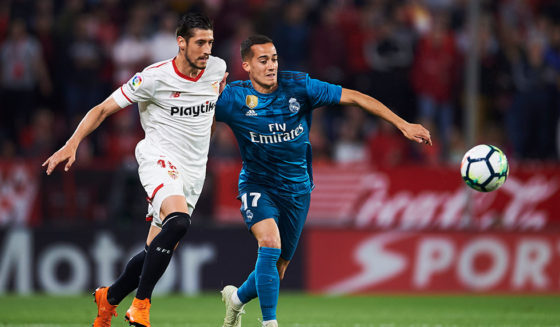 SEVILLE, SPAIN - MAY 09: Lucas Vazquez of Real Madrid CF (R) competes for the ball with Sergio Escudero of Sevilla FC (L) during the La Liga match between Sevilla FC and Real Madrid at Ramon Sanchez Pizjuan stadium on May 9, 2018 in Seville, Spain. (Photo by Aitor Alcalde/Getty Images)