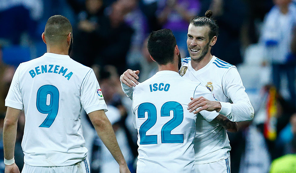 Real Madrid's Welsh forward Gareth Bale (R) celebrates goal during the Spanish league football match between Real Madrid and Celta Vigo at the Santiago Bernabeu Stadium in Madrid on May 12, 2018. (Photo by Benjamin CREMEL / AFP) (Photo credit should read BENJAMIN CREMEL/AFP/Getty Images)
