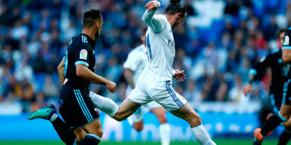 Real Madrid's Welsh forward Gareth Bale shoots to score a goal during the Spanish league football match between Real Madrid and Celta Vigo at the Santiago Bernabeu stadium in Madrid on May 12, 2018. (Photo by Benjamin CREMEL / AFP) (Photo credit should read BENJAMIN CREMEL/AFP/Getty Images)