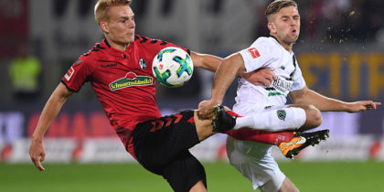 FREIBURG GERMANY - SEPTEMBER 20: Philipp Lienhart (L) of SC Freiburg challenges Niclas Fuellkrug (R) of Hannover 96 during the Bundesliga match between Sport Club Freiburg and Hannover 96 at Schwarzwald-Stadion on September 20, 2017 in Freiburg, Germany. (Photo by Michael Kienzler/Bongarts/Getty Images)
